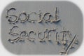 social security written in the sand. economy retirement business background. abstract concept financial creative design element. Royalty Free Stock Photo
