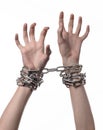 Social theme: hands tied a metal chain on a white background