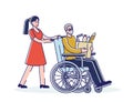 Social worker helping old man on wheelchair with grocery shopping. Female volunteer with senior male Royalty Free Stock Photo