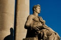 Socialist sculpture against blue sky.