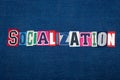 SOCIALIZATION collage of word text, multi colored fabric on blue denim, socially adept and confidence concept Royalty Free Stock Photo