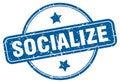 socialize stamp. socialize round grunge sign.