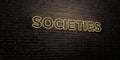 SOCIETIES -Realistic Neon Sign on Brick Wall background - 3D rendered royalty free stock image