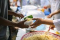 The Society of Sharing Food to Homeless and the Poorest: The Concept of Feeding : The hands of the rich give food to the hands of
