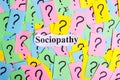 Sociopathy Syndrome text on colorful sticky notes Against the background of question marks