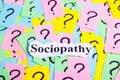 Sociopathy Syndrome text on colorful sticky notes Against the background of question marks