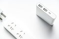 Socket plug electric power bar and white silver power bank isolate. save energy and reduce energy efficiency concept Royalty Free Stock Photo