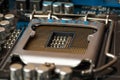 Socket for processor on circuit board. Electronic microchip computer hardware technology. Printed motherboard digital equipment