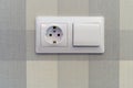 Socket and switch white on the background of paper Wallpaper on the wall. Background-vertical and horizontal blue Royalty Free Stock Photo