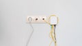 Socket with tangled wires, cables and Internet router on a white background Royalty Free Stock Photo