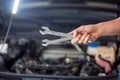 Close-up photo of wrenches in mans hand Royalty Free Stock Photo