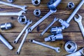 Sockets with socket wrench and spanners on a wooden background. Top view Royalty Free Stock Photo