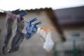 Socks are dried on a rope with clothespins