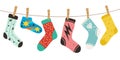 Socks on rope. Female, male and kids trendy fashion socks with color patterns. Stylish cotton and woolen long and short
