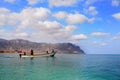 Socotra, Yemen, March 9, 2015 Simple rural fishermen returning from fishing to drag the boat out of the water on the shores of an