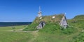 Sod church by Atlantic Ocean in Newfoundland