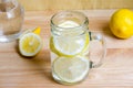 Soda with lemon in jar on wooden table - lemon soda Royalty Free Stock Photo