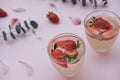 Soda with strawberries on a pink background. Summer refreshing d