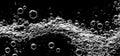 Soda water bubbles splashing underwater against black background Royalty Free Stock Photo