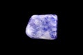 Sodalite stone texture on black background. Macro closeup Royalty Free Stock Photo