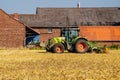 Soest, Germany - July 30, 2019: Claas arion-620 farm tractor with cultivator on the field