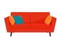 Red sofa with yellow and blue pillows Royalty Free Stock Photo