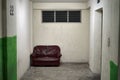 Sofa abandoned to rest while waiting for the elevator