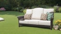 An sofa and chair on lawn at a gardensimilar im...