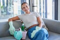 Sofa, cleaning service and business woman in portrait with cleaner product basket and house living room work with home Royalty Free Stock Photo