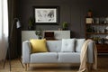 Sofa with grey and yellow pillows, lamp, painting and cupb Royalty Free Stock Photo