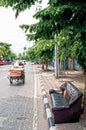 Sofa is left empty in the street as the moto taxi driver has gone on a course