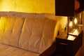 Sofa in Livng room with a beautiful yellow light. Nice interior in room