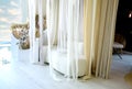 Sofa milky color and transparent curtains. Romantic setting