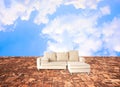 Sofa onstone floor and in the sky Royalty Free Stock Photo