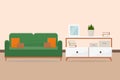 Sofa with pillows and a cabinet with books and a plant room interior