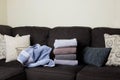 sofa with pillows and folded laundry Royalty Free Stock Photo