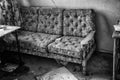 Old sofa in an abandoned building Royalty Free Stock Photo