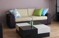 Sofa with three pillows and table