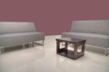 Sofas with coffee table with Maroon Wall