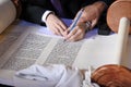 Sofer completing the final letters of sefer Torah Royalty Free Stock Photo