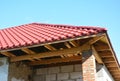 Soffit and Fascia installation. Roofing house construction and insulation detail. Metal roof.