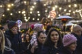 SOFIA, BULGARIA - DEC 21: A father carrying his child on his arms under Christmas lights