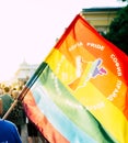 Sofia / Bulgaria - 10 June 2019: Guy holding big Rainbow Flag in the Sofia Pride March walking in the street