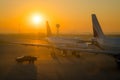 SOFIA, BULGARIA - March, 2019: Indigo commercial airplanes and security truck at sunrise at the airport ready to take off. Plane