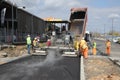 Sofia, Bulgaria - MaWorkers behind a track asphalt paver machine