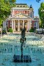 SOFIA, BULGARIA, SEPTEMBER 2, 2018: People are enjoyingg sunny summer day next to the fountain in front of the Ivan Vazov theatre Royalty Free Stock Photo