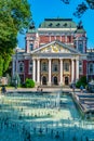 SOFIA, BULGARIA, SEPTEMBER 2, 2018: People are enjoyingg sunny summer day next to the fountain in front of the Ivan Vazov theatre Royalty Free Stock Photo