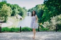 Sofia Park, Ukraine. Brunette girl in a landscaped park. Girl on the background of a fountain in a beautiful park. Fountain with a