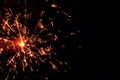 Soft abstract firework glow in red and gold tones on dark background with copy space Royalty Free Stock Photo