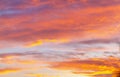 Soft, airy sky in the evening with feathery clouds in orange and blue shades